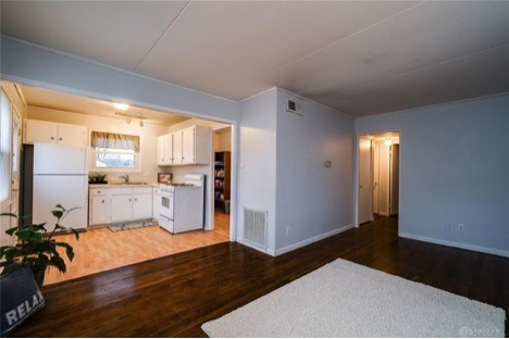 Large living room with hardwood floors. - 5386 Rawlings Dr