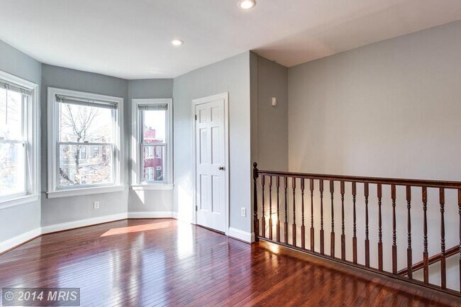 Living Room with Laundry - 1541 3rd St. NW