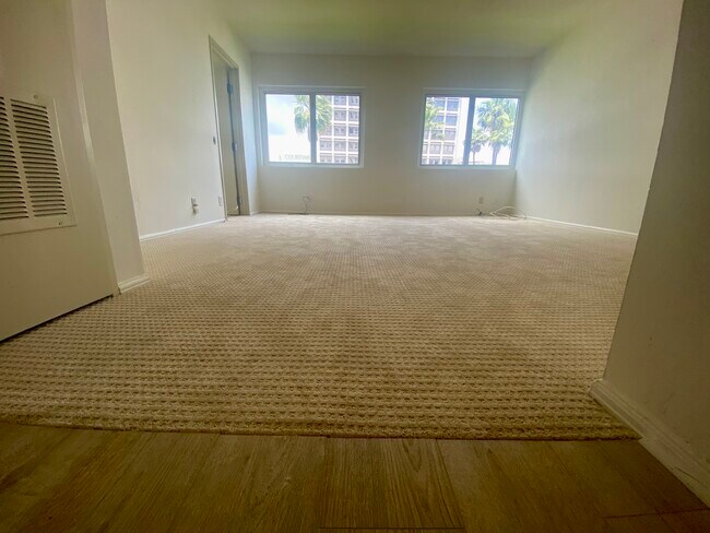 As you enter Living Room. Kitchen to Right. Washer Dryer with storage room to your left. - 525 E Seaside Way