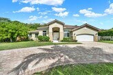 Primary Photo - Elegant 4-Bedroom Pool Home in Exclusive G...