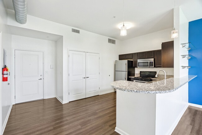 1BR Entry/Kitchen - The Delaware Apartments