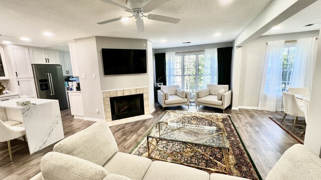 Living Room w/ wood burning fireplace - 3800 Green Ridge Ct