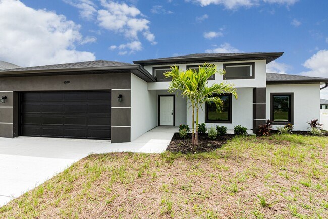 Building Photo - LARGE 4 BEDROOM-3 BATHROOM-2 CAR GARAGE-CA...
