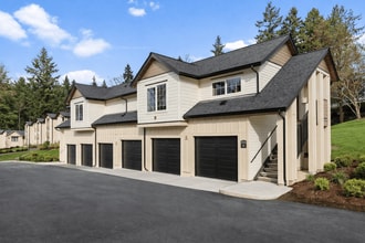 Modern Carriage-style Studio Apartment Building with Private Garages. - Boardwalk at University Place Apartments