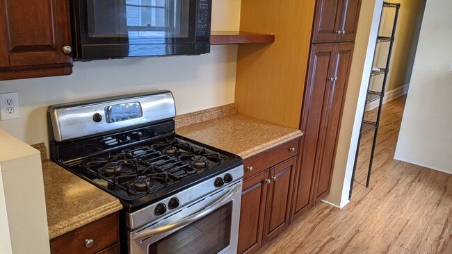 Kitchen with gas stove and microwave - 2149 Sherman Ave