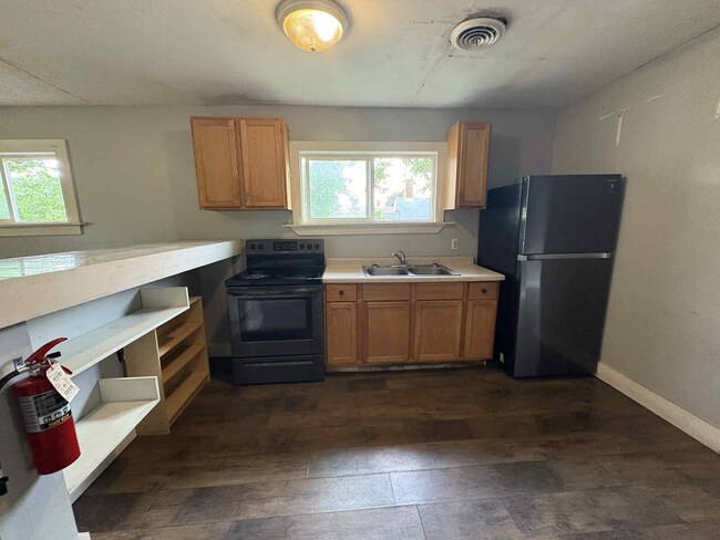 Kitchen with Newer appliances and nice natural light. - 945 W 9th St