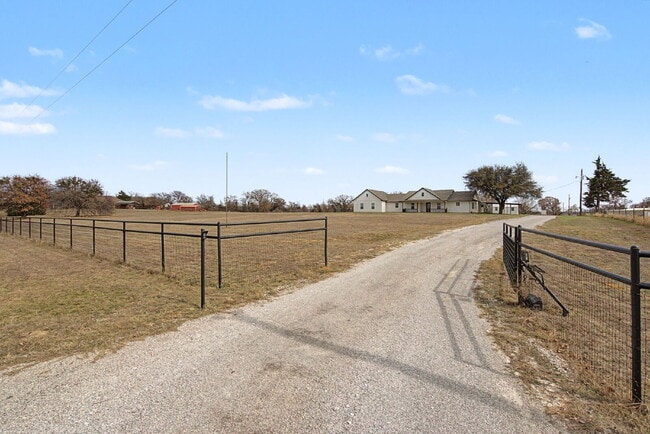 Building Photo - “4-Bedroom, 3-Bath Farmhouse Charm Meets Modern Luxury on a Serene 5-Acre Lot!”