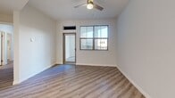 Located at 3145 Market St in Riverside, CA, this well-appointed 2-bedroom, 2-bathroom residence offers a thoughtfully designed single-floor layout with a clean, modern aesthetic. Light wood-tone flooring flows seamlessly throughout, complemented by neutral walls and crisp white trim that create a bright, cohesive atmosphere.

The open-concept living and dining area is anchored by a ceiling fan and recessed lighting, providing an airy feel with ample room for entertaining. The kitchen is a standout feature, boasting an oversized island with a quartz countertop and undermount sink, white shaker cabinetry extending to the ceiling, and a full suite of stainless steel appliances including a gas range, microwave, and refrigerator. A pantry with louvered doors adds convenient storage.

The spacious primary bedroom offers natural light through large windows and direct access to a private balcony. The second bedroom is equally well-lit with its own window. Both bathrooms are finished consistently with quartz vanity tops, white cabinetry, and tub/shower combinations featuring tile surrounds and brushed nickel fixtures.

Additional highlights include three closets providing generous storage, a dedicated laundry area, and a balcony ideal for outdoor relaxation.