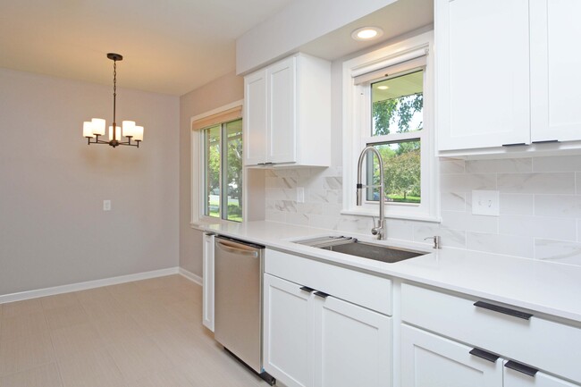 New white cabinets, quartz countertops and tile floor - 5206 Grandview Ln