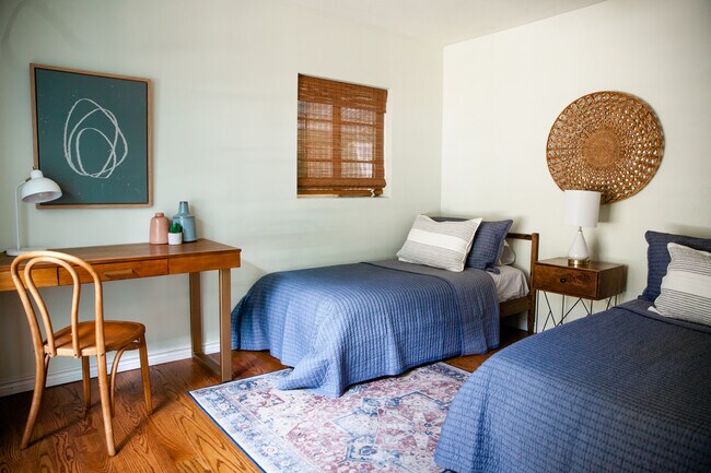 2 twin beds w/ desk; natural light during day, blackout curtains for night - 1726 Giles St