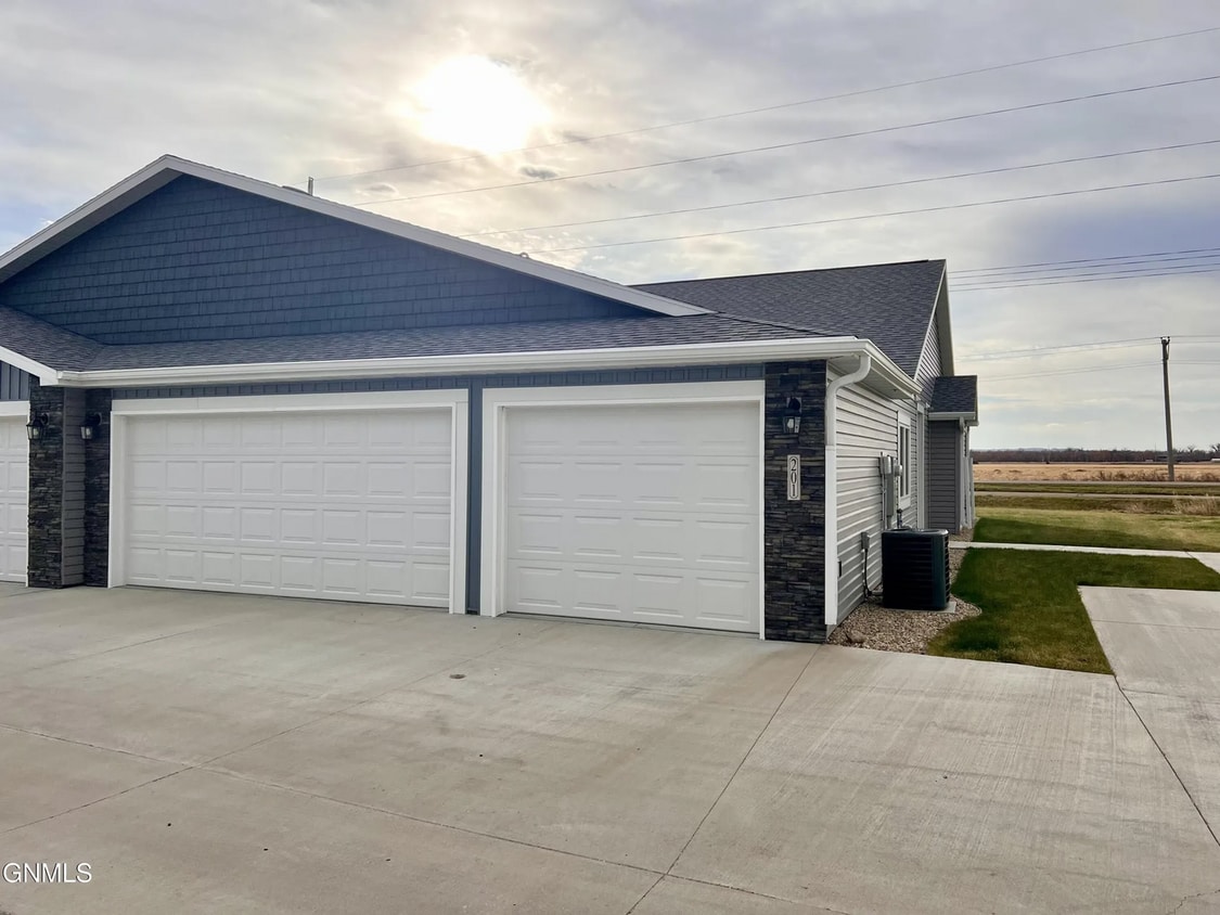 Primary Photo - Quiet location - Check. Open floorplan - Check. 3-stall heated garage - Check. Welcome Home!
