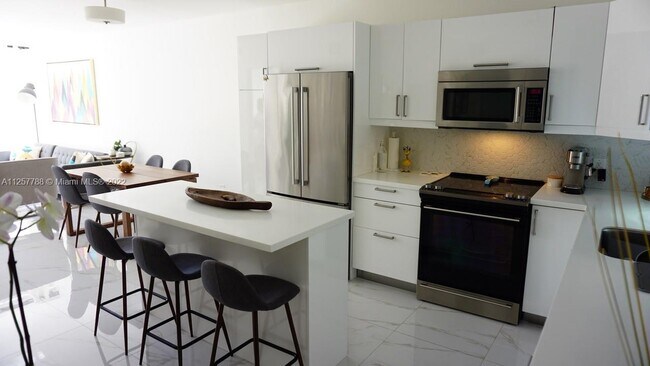 Building Photo - 1651 NE 115th St  17C Miami Fl 33181