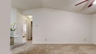 Located at 3909 Sunbeam Rd in Jacksonville, FL, this single-story, one-bedroom, one-bathroom residence makes efficient use of its thoughtfully designed floor plan. The open-concept kitchen and living area serves as the heart of the home, featuring vaulted ceilings that lend a sense of openness and airiness well beyond its physical footprint. The kitchen is outfitted with white shaker-style cabinetry, black appliances including a refrigerator, electric range, and dishwasher, a double-basin sink with a peninsula counter, and stone-look tile flooring. An adjacent pantry with built-in shelving provides generous storage. The spacious bedroom is carpeted and benefits from a ceiling fan, a natural light-admitting window, and access to multiple closets, offering ample organization options. The bathroom features a single-vanity with white cabinetry, a tub-shower combination, and coordinating stone-look tile flooring. A dedicated utility closet houses the water heater and washer/dryer hookups, adding practical convenience. Throughout, neutral tones, textured ceilings, and carpet in living and sleeping areas create a clean, cohesive aesthetic.