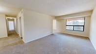 This well-appointed apartment offers 1270 square feet of living space on a single floor. The layout includes three bedrooms, two full bathrooms, a combined kitchen and living area, and a dedicated laundry room. The primary bedroom is generously sized at 240 square feet, providing ample space for relaxation and storage.

The kitchen is a highlight, featuring wooden cabinetry, black appliances, and elegant granite countertops. The galley-style layout maximizes efficiency while offering plenty of counter space for meal preparation. Adjacent to the kitchen, the living area provides a spacious and open feel, perfect for entertaining or relaxing.

Bedrooms are carpeted for comfort and feature neutral-toned walls, creating a calm and inviting atmosphere. Each bedroom includes closet space, with the primary bedroom likely offering additional storage options. The bathrooms are well-appointed with tiled floors and walls, and include combination tub-showers for versatility.

The in-unit laundry room is a convenient feature, equipped with a full-sized washer and dryer. Large windows throughout the apartment allow for natural light, enhancing the overall brightness of the space. The neutral color palette throughout provides a blank canvas for personal decorating styles.

Located at 509 Mandan Rd, Unit 304, in Greenbelt, MD, this apartment combines comfort, functionality, and modern amenities in a desirable location.