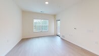 Located at 6822 Shannon Parkway in Union City, GA, this one-bedroom, one-bathroom residence offers a well-designed single-floor layout with a clean, neutral aesthetic throughout. The open-concept kitchen and living area serves as the heart of the home, featuring light wood-style flooring that extends throughout the main living spaces. The kitchen is equipped with light maple cabinetry, granite countertops, a central island for additional prep space and seating, and a full suite of stainless steel appliances including a refrigerator, range, microwave, and dishwasher. Recessed and flush-mount lighting ensures the kitchen is well-lit for everyday use. The living area benefits from large windows dressed with vertical blinds, allowing generous natural light and outdoor views to fill the space. The bedroom is carpeted for comfort and includes its own window for additional natural light. A dedicated walk-in closet off the bedroom provides extensive wire shelving and hanging space for organized storage. The bathroom features a warm wood vanity with granite countertop, tile shower surround, and brushed nickel grab bars, combining practicality with clean design. This residence offers a functional and comfortable living environment.