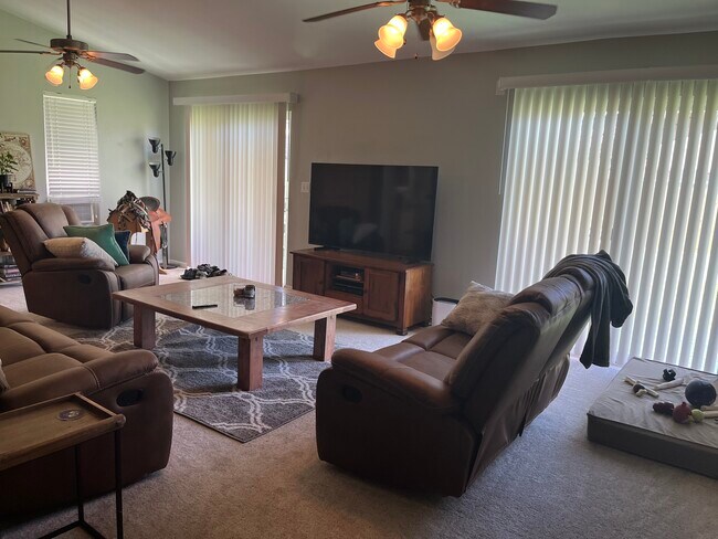 Living room with sliding doors opening to backyard - 6740 Pontchartrain Blvd