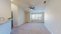 Located at 291 Alabaster Dr in Dothan, Alabama, this single-story home offers a functional and well-appointed layout across four bedrooms and two full bathrooms. The kitchen stands out as a highlight, featuring white shaker-style cabinetry, granite countertops, a classic subway tile backsplash, stainless steel appliances including a refrigerator and electric range, and durable wood-look flooring. A peninsula with a sink provides a convenient transition between the kitchen and the adjacent dining and living areas. The bedrooms are finished with plush carpet and neutral-toned walls, creating a calm and comfortable atmosphere throughout. Several rooms feature ceiling fans and windows fitted with blinds that allow for natural light while maintaining privacy. The primary bedroom is generously sized with vaulted ceiling accents and a dedicated closet. Both bathrooms include tub-shower combinations with white tile surrounds; one bathroom showcases wood-look flooring and a granite-topped vanity. Additional spaces include a laundry room, a utility room, a hallway connecting the main areas, and four closets distributed throughout the home. The overall design is clean, practical, and well-suited for everyday living.