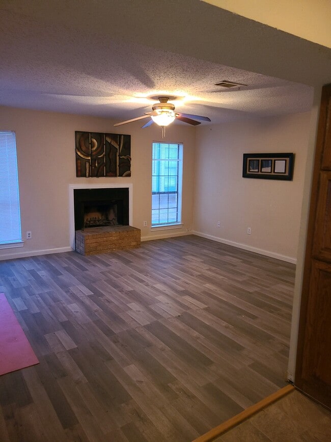 Photos are of identical layout - new flooring currently being installed - 201 W Trinity St