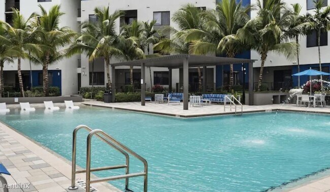 Building Photo - Studio, 1 bath Condo - 8850 NW 36th St APA...