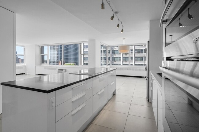 Open kitchen, dining space, living space - 4250 N Marine Dr