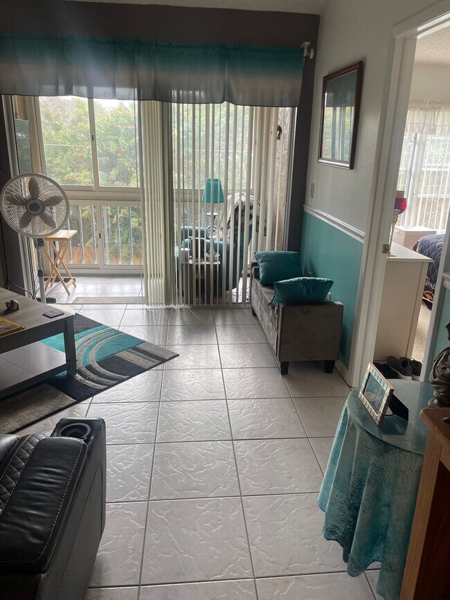 Living Room and Screened in Porch - 6424 Spring Flower Dr