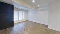 This contemporary townhome in South Salt Lake offers 1190 square feet of living space spread across three floors. The property boasts 3 bedrooms and 3 bathrooms, providing ample space for comfortable living. The home's layout includes 2 staircases and 2 hallways, ensuring efficient movement between floors.

The heart of the home is a modern kitchen featuring dark wood cabinetry, stainless steel appliances, and a central island, perfect for meal preparation and casual dining. The kitchen opens to a living area, creating an open-concept space ideal for entertaining.

Bedrooms are generously sized, with the primary bedroom measuring 180 square feet. Carpeted floors in the bedrooms add warmth and comfort. The bathrooms are well-appointed, featuring contemporary fixtures and finishes.

Storage is abundant throughout the home, with a dedicated closet and built-in shelving in various rooms. The property also includes an attached garage for convenient parking and additional storage.

The home's design emphasizes functionality and style, with a neutral color palette, recessed lighting, and a mix of carpet and hardwood flooring. Large windows in the kitchen area allow for natural light, enhancing the bright and airy feel of the space.

Located at 421 E Xavier Ct, this townhome offers a blend of modern amenities and practical living spaces, making it an attractive option for those seeking a contemporary urban lifestyle in South Salt Lake.