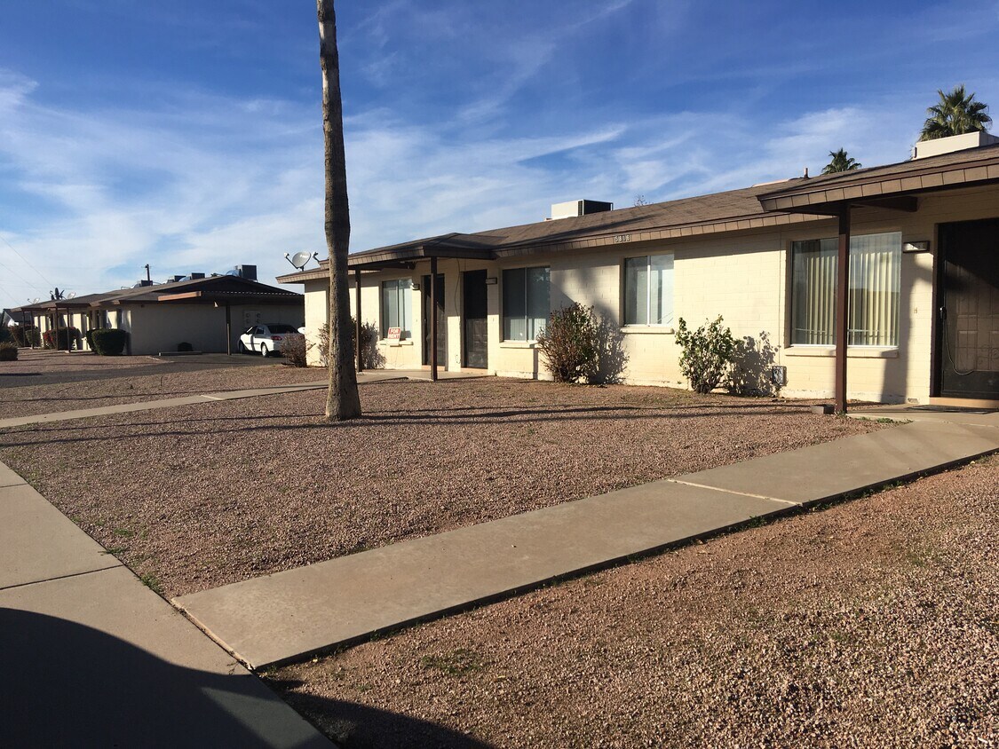Open and clean front w Palm tree. - 5816 E Albany St