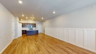 Located at 1135 Latitude Circle in Twin Falls, Idaho, this single-story, 3-bedroom, 2-bathroom home offers a thoughtfully designed layout with quality finishes throughout. The open-concept living and kitchen area serves as the heart of the home, showcasing warm hardwood flooring, vaulted ceilings, and elegant board-and-batten wainscoting that adds a refined architectural touch. The kitchen is well-appointed with rich dark cabinetry, stainless steel appliances including a refrigerator, range, and microwave, a double-basin sink set into a peninsula with light countertops, and a dedicated pantry for added storage. The spacious primary bedroom features hardwood flooring and generous proportions, while the two additional bedrooms are finished with plush carpeting, wainscoting accents, and natural light from bright windows. Both bathrooms carry consistent dark cabinetry and light countertops, with one featuring a full tub-shower combination. A dedicated laundry room with shelving and full-size washer and dryer hookups adds everyday convenience. The home also includes two closets, a patio for outdoor enjoyment, and recessed lighting throughout, creating a clean and inviting ambiance.