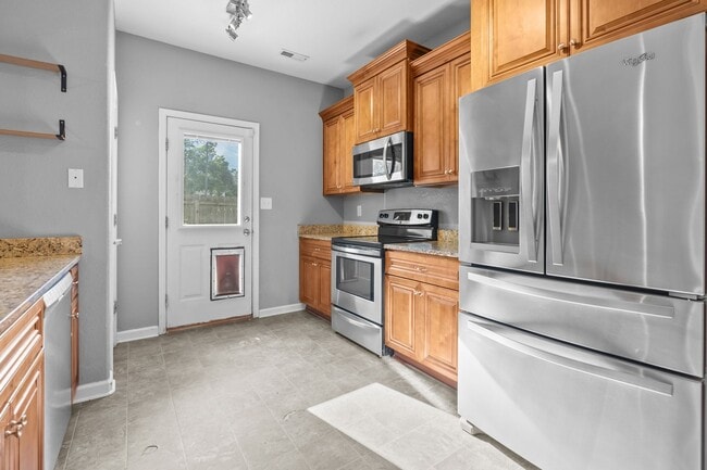 Building Photo - Spacious 4-Bedroom Home with First-Floor S...