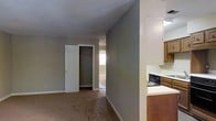 Located at 6014 Sedgewick Dr in Raleigh, NC, this single-floor home offers a straightforward and functional layout designed for comfortable everyday living. The floor plan reveals a well-organized arrangement of rooms that flow naturally from one space to the next, providing a sense of openness throughout.

The living areas are finished with wall-to-wall carpeting, lending a warm and inviting atmosphere to the main rooms. Neutral-toned walls in a soft gray palette keep the interior feeling clean and versatile, ready to accommodate a variety of décor styles. Natural light filters in through multiple windows, brightening the interior and enhancing the overall ambiance.

The kitchen is efficiently designed with warm wood-toned cabinetry, light countertops, and built-in appliances including a dishwasher, offering practical functionality for meal preparation. It is conveniently positioned adjacent to the main living areas for easy access.

Bedrooms are generously sized and include closet space with rod storage, providing ample room for organization. The open doorways between rooms create a connected feel throughout the home. The overall layout, as seen in the dollhouse view, reflects a compact yet well-utilized footprint, making this Raleigh home a practical and comfortable living space.