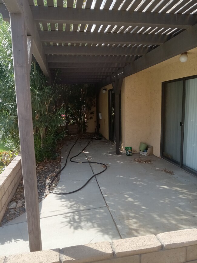 Back porch where you can put a table and chairs, on south "sunset" side. - 19135 Elm Dr