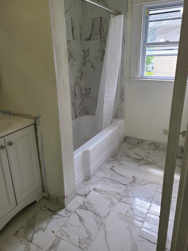 New premium porcelain bathroom tiles - 357 E 123rd St