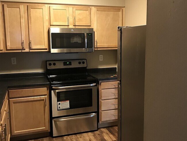 Kitchen with stainless steel appliances - 16045 Joplin Ave