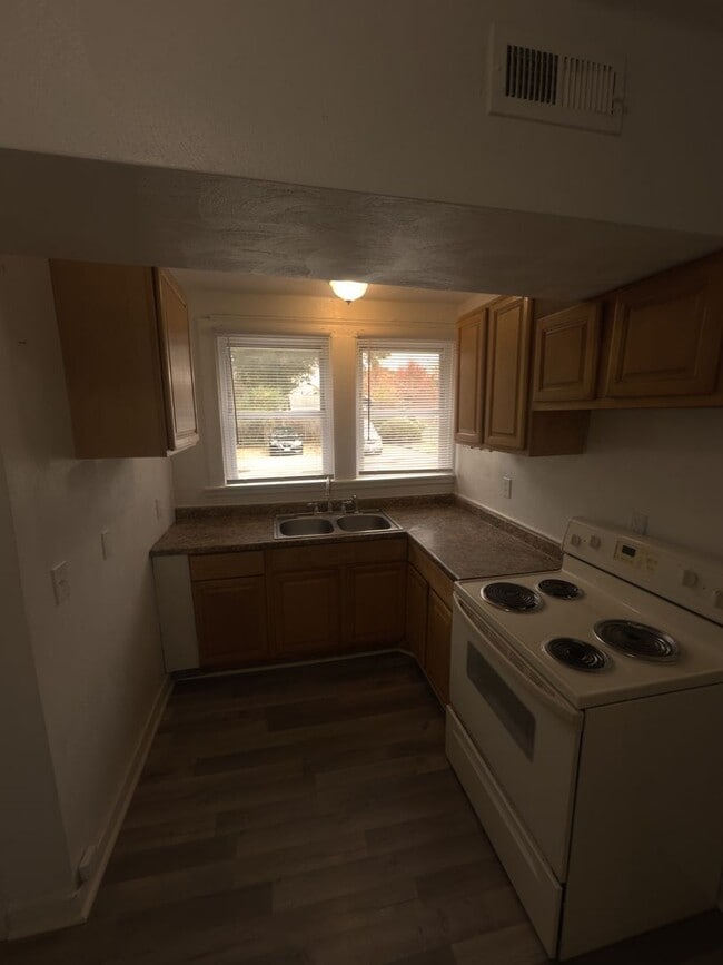 Building Photo - Three Bedroom Available Soon!