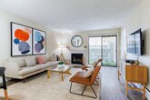 Located at 300 Hilary Way in Vallejo, CA, this single-floor, 2-bedroom, 2-bathroom residence offers a well-organized layout with a clean, modern aesthetic throughout. The combined living and dining area serves as the heart of the home, featuring light hardwood-style flooring, a tiled fireplace, and large sliding glass doors with vertical blinds that invite natural light and provide access to a private patio. The kitchen is designed for efficiency, with white cabinetry extending to the ceiling, white appliances, a double-basin sink, and light flooring that keeps the space feeling bright and cohesive. The primary bedroom is a comfortable retreat with carpeted flooring, multiple windows offering greenery views, and ample closet space. The second bedroom also features carpet, a sliding-door closet, and natural light. Both bathrooms are finished with wood-style flooring, tub-shower combinations, and clean white fixtures. A dedicated hallway connects the bedrooms and bathrooms, adding to the functional flow of the home. With three closets total, the residence provides generous storage. The entrance and patio round out the layout, adding convenience and a touch of outdoor living to this well-appointed Vallejo home.