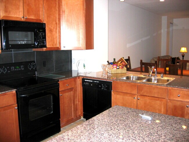 Open kitchen with granite countertop of a 2 bedroom condo for rent in DC - 400 Massachusetts Ave NW