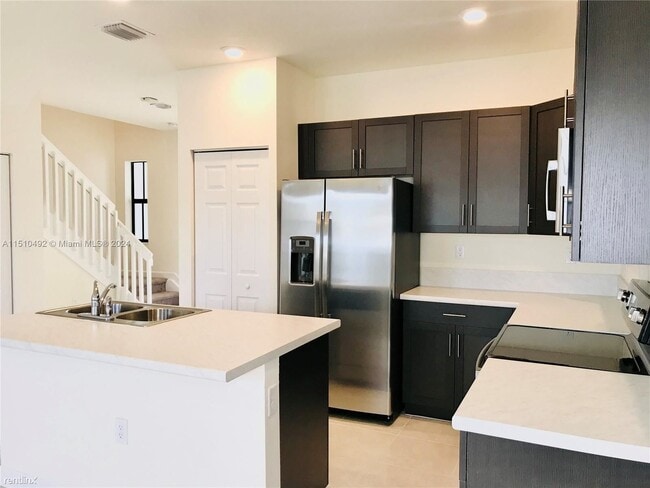 Foto del edificio - 3 br, 2.5 bath Townhome - 10919 W 33rd Ln