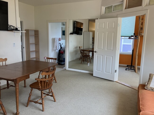 Living room leading into first bedroom and bath. - 1975 SE Crystal Lake Dr