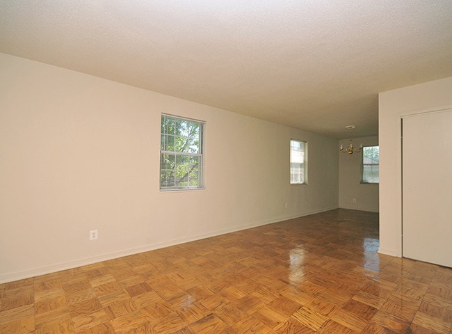Living Room with Parquet Flooring - Olde Salem Village