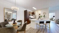 Located in Rancho Cucamonga, CA, this well-designed two-bedroom, two-bathroom residence offers a thoughtful single-level layout with modern finishes throughout. The open-concept living area seamlessly connects the kitchen, dining, and living spaces, creating an inviting and functional flow. The kitchen is a standout feature, showcasing rich dark-wood cabinetry, stainless steel appliances, a skylight, and a generous quartz peninsula with bar seating — ideal for both everyday meals and entertaining. Light wood-tone flooring runs throughout, enhancing the bright, airy ambiance. The adjacent dining area is framed by textured accent walls and crown molding, adding warmth and dimension. The living room offers a comfortable retreat with grasscloth-style wall treatments and clean, neutral tones. The primary bedroom is a spacious haven with large windows that bring in natural light, a ceiling fan, and direct access to a walk-in closet. The second bedroom also features generous windows and a serene atmosphere. Both bathrooms are well-appointed with dark wood vanities and white quartz countertops. Each bedroom is complemented by its own dedicated closet with built-in shelving, providing ample storage. The overall aesthetic is clean, contemporary, and cohesive throughout.