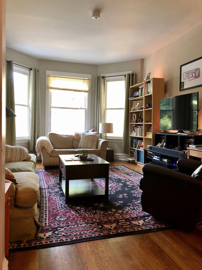 Sun-filled living room with bay window - 2429 W Leland Ave