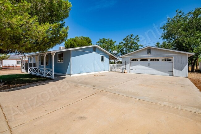Building Photo - LARGE FENCED YARD WITH DETACHED GARAGE