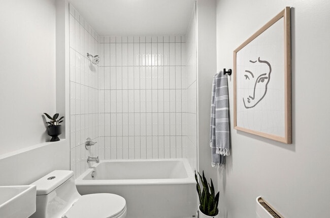 Tiled bathroom w/ tub - 1825 N Rosa Parks Way