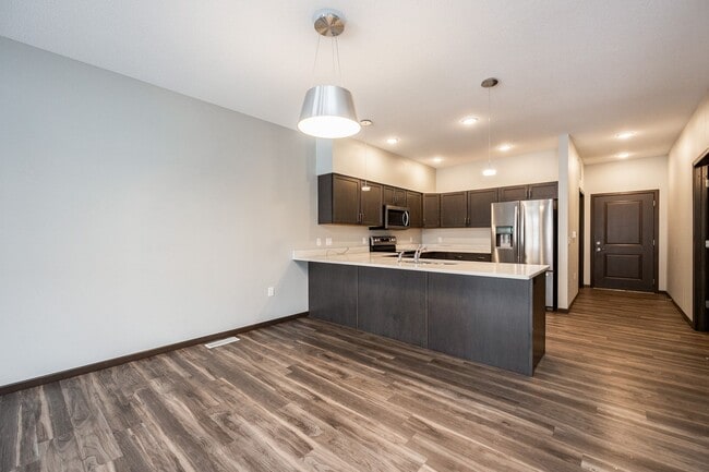 Building Photo - Spacious Townhome with Heated Garage Just ...