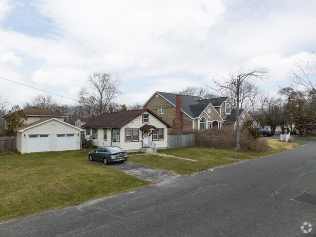 The neighborhood makes all the difference. Located just off the Long Island Express way.