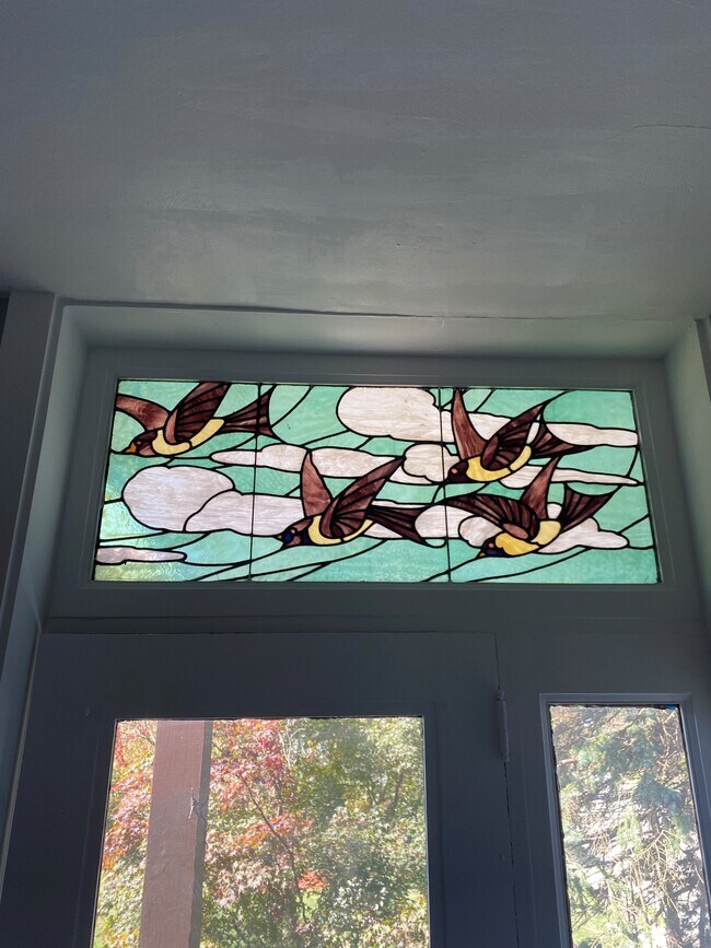 stained glass window. living room - 201 E End Ave