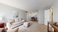 Located at 505 N Tyler Rd in Wichita, Kansas, this single-floor, one-bedroom, one-bathroom unit offers a well-organized layout across a comfortable footprint. The living room is bright and welcoming, featuring soft carpeting, a textured ceiling, and a sliding glass door that fills the space with natural light. It flows seamlessly into the dining area, which is appointed with a ceiling fan and a closet for additional storage. The galley-style kitchen is efficiently designed with gray cabinetry, laminate countertops, a single-basin sink, and wood-look flooring, providing a clean and functional workspace. A dedicated office space offers a quiet retreat, carpeted and versatile for a variety of uses. The spacious primary bedroom features plush carpet, a textured ceiling, and a reach-in closet with sliding doors, providing ample storage. The bathroom is neatly finished with wood-look flooring, a single-sink vanity with laminate countertops, gray cabinetry, and a large mirror. Neutral gray walls and consistent soft flooring throughout the unit create a cohesive, calm ambiance, making this a practical and comfortable space suited for everyday living.
