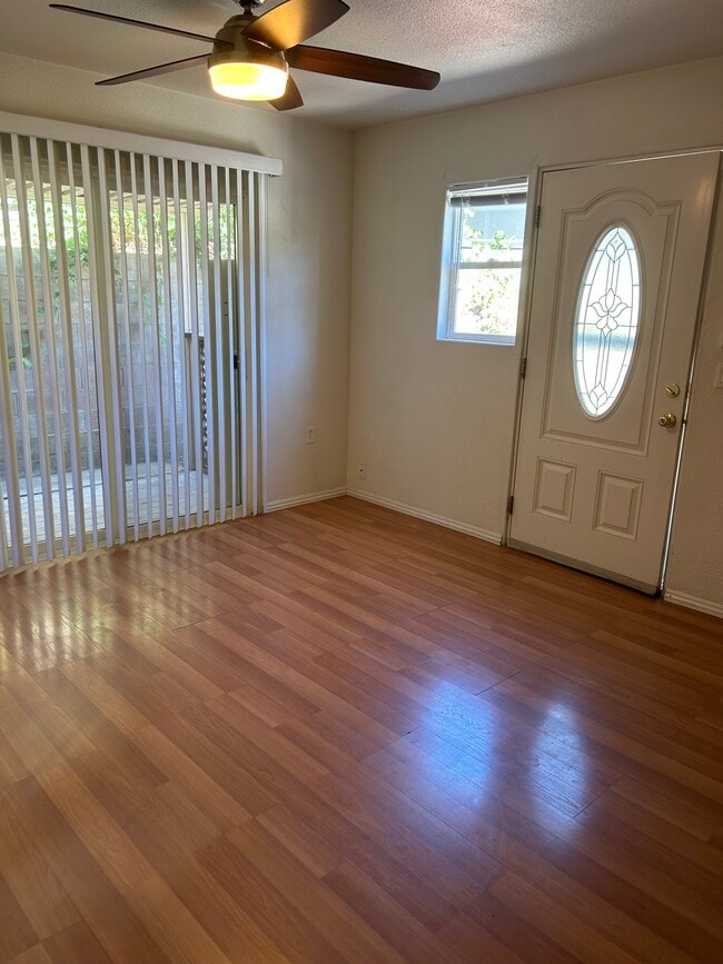 Main living/dining area with access to small private patio. - 621 5th St