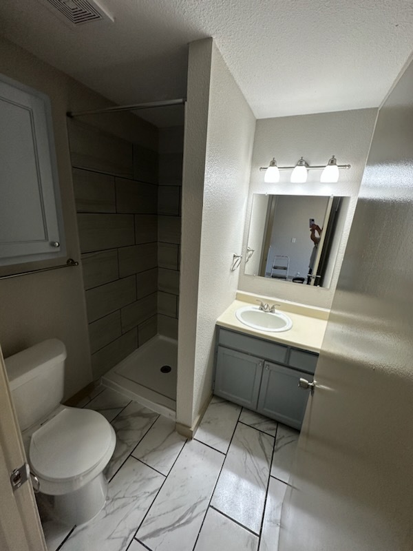 STUDIO BATHROOM - Commerce Village Apartments Phase II