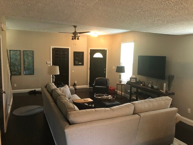 Living Room. View from Kitchen. - 210 Heritage Ln